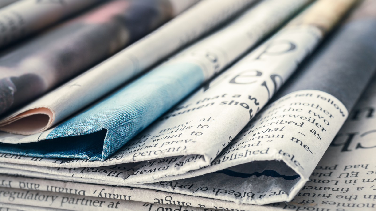 Newspapers spread on table