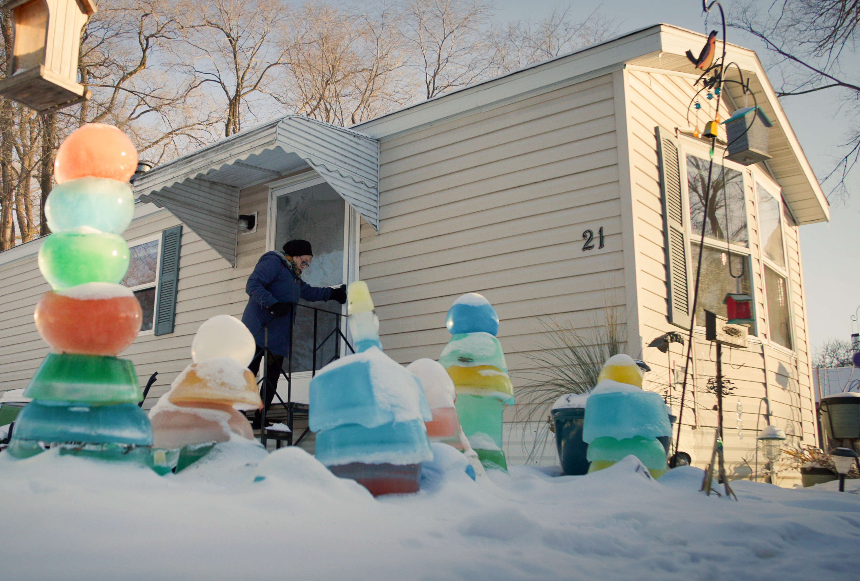 white woman entering her manufactured home
