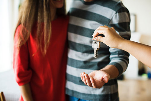 Couple with house key