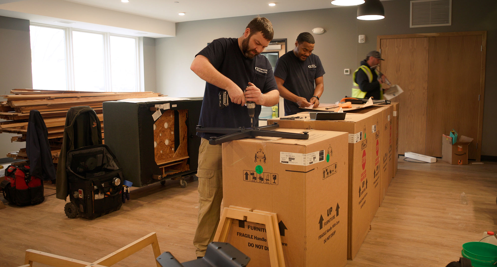 Men working with packed boxes